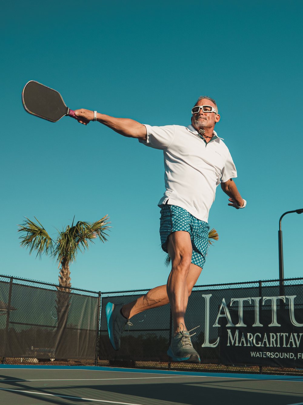 Pickleball action shot at Latitude Margaritaville Watersound — lifestyle content, Florida Panhandle